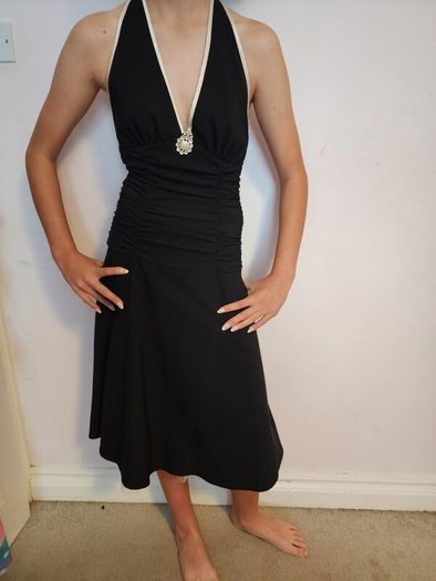Black halterneck dress with cream trim