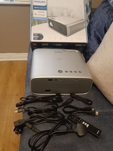 philips neopix ultra 2tv+ home projector and height adjustable stand, built in speakers and android TV with play store stand comes with power point bracket on it as seen in pictures also remote and phone holder