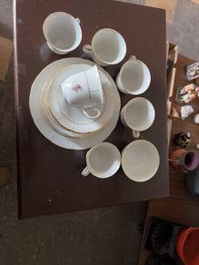 Six piece set of finebone  China, six cups, six saucers, six side plates, one larger plate and sugar bowl.