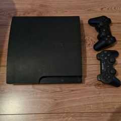 ps3  plus 2 controllers and 30 games