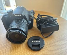 Canon EOS 1200D, DSLR camera with standard lens and charger