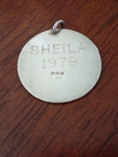 Sterling silver charm.