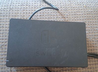 Portable Nitendo Switch, charging dock.