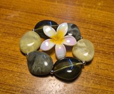 Modern Green Bracelet with a White Flowery Clip