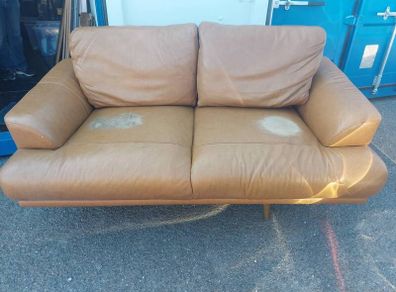 Brown leather sofa and matching foot poof