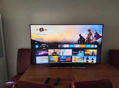 Samsung Curved 65" Smart TV for sale. Back lights replaced six.months left on guarantee