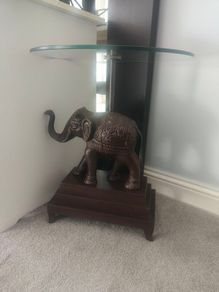 Ornate elephant glass table