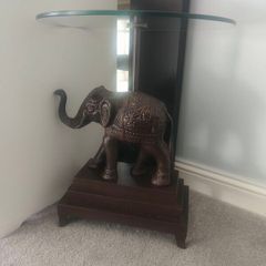 Ornate elephant glass table