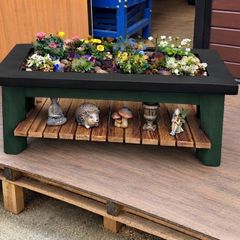 Large garden planter with display shelf