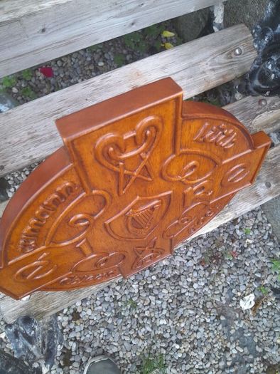carved g.aa.a shield