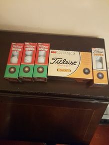 Brand new box of Titleist pro v1 and PTS roll golf balls