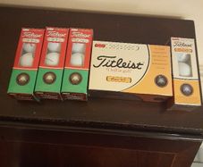 Brand new box of Titleist pro v1 and PTS roll golf balls