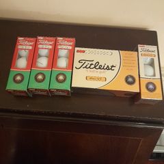 Brand new box of Titleist pro v1 and PTS roll golf balls
