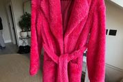 Bright pink faux fur robe coat by Russian designer