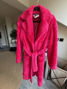 Bright pink faux fur robe coat by Russian designer