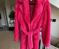 Bright pink faux fur robe coat by Russian designer