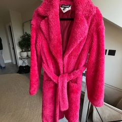 Bright pink faux fur robe coat by Russian designer