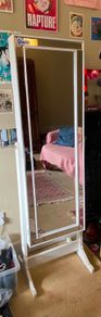 Standing storage mirror