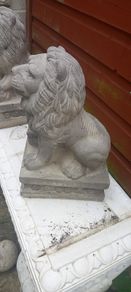 handcrafted concrete lions