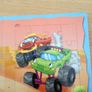 Jigsaws of racing cars in a book Image 2