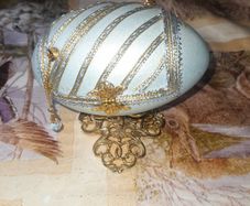 Beautiful Turquoise Hinged Egg Jewelry Box, 4 petal opening Gold Tone filigree borders on stand,