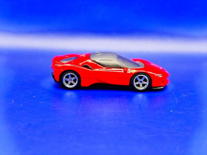 Hot Wheels Ferrari SF90 Stradale with custom wheels.
