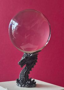 Crystal/glass ball and metal dragon stand.