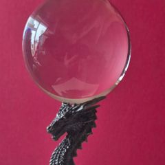 Crystal/glass ball and metal dragon stand.