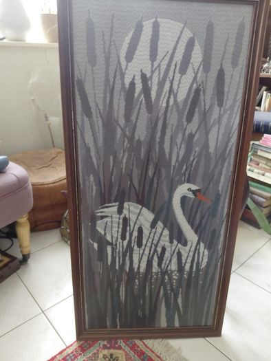 Vintage framed needlepoint tapestry depicting a white swan swimming