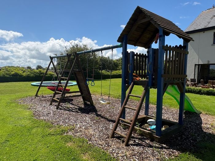 Swing slide climbing wall