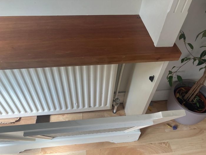 Radiator cover and display unit