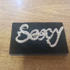 "Sexy" brooch