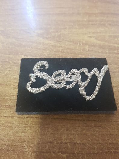 "Sexy" brooch