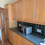 Entire Kitchen including Neff Double Oven, Integrated Fridge-Freezer, Bosch Dishwasher,  Faber Extractor fan, and Microwave. Image 7