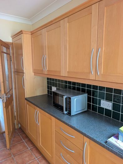 Entire Kitchen including Neff Double Oven, Integrated Fridge-Freezer, Bosch Dishwasher,  Faber Extractor fan, and Microwave.