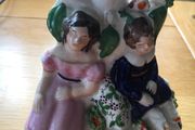 Staffordshire figurine of sleeping couple - spill vase