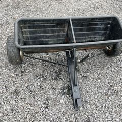 Lawn seed and fertiliser spreader