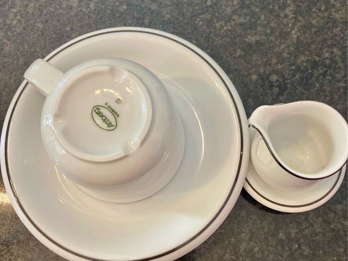 Coffee cup and cream jug
