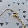 925 sterling silver bracelet with yellow gold plating and V shaped pendant. Image 6
