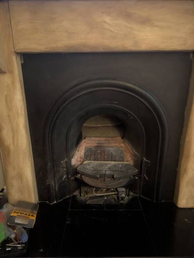 Fireplace surround and cast iron insert