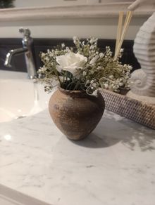 Mini rustic vase with flowers