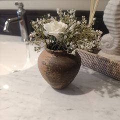 Mini rustic vase with flowers