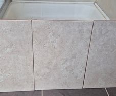Beige stone-effect ceramic wall tiles