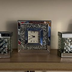 Silver clock and candle holders