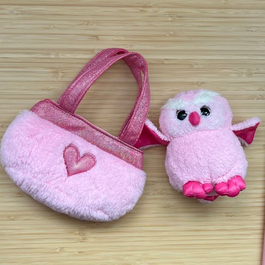 Toy beanie owl with a bag