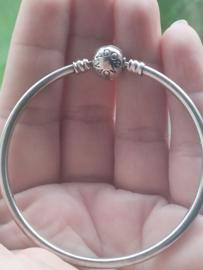 Pandora Moments 925 sterling silver bangle bracelet with a ball clasp.