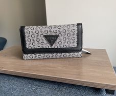 Guess purse. Never used but slightly worn due to storage.