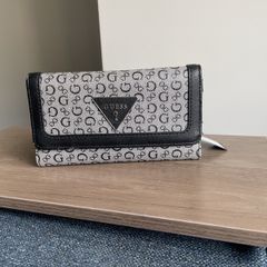 Guess purse. Never used but slightly worn due to storage.