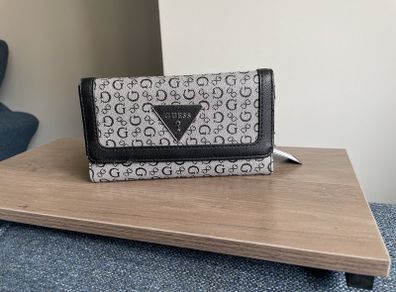Guess purse. Never used but slightly worn due to storage.