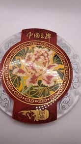 Vintage Chinese fabric in a glass plate